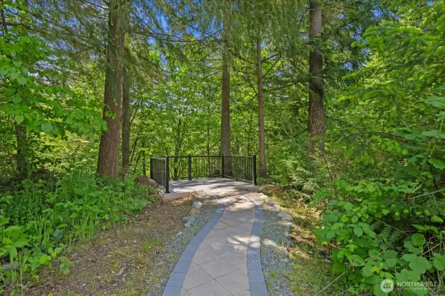 Brick pathway on the property leads to serene overlook of the creek below.  Wonderful place to take in nature and wildlife!