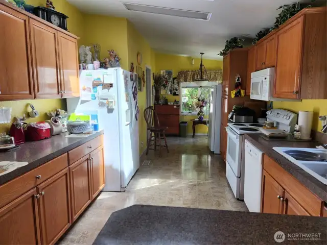 Kitchen has a sky light for more lighting.