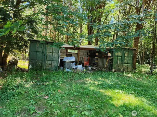 2 containers with and roof between them