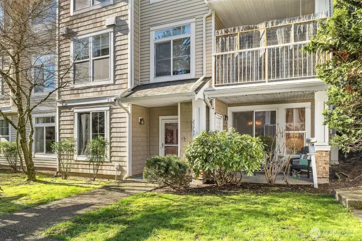 A lush green lawn greets you as you arrive home, offering a vibrant and inviting atmosphere.