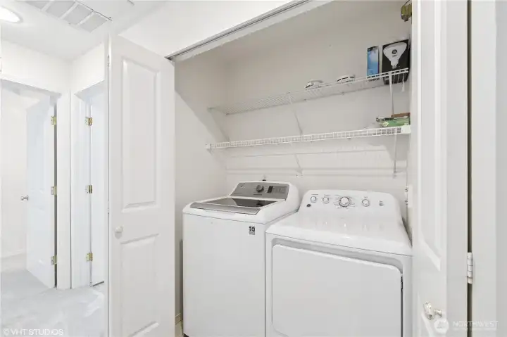 Conveniently located full sized washer and dryer.