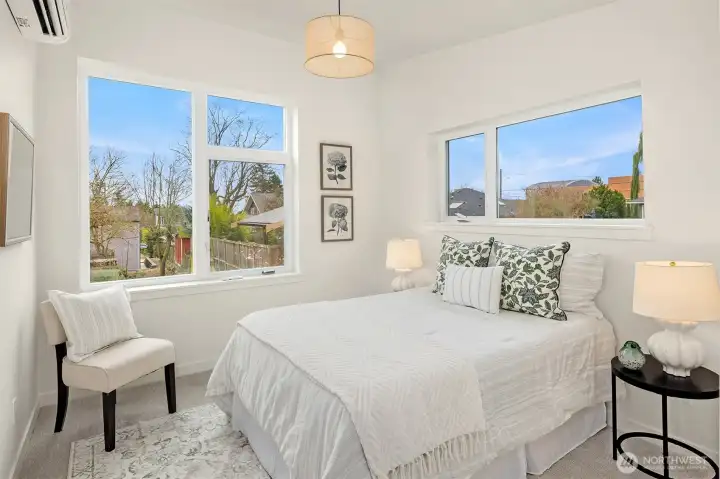 The second upstairs bedroom.  This room also gets incredible light and has high ceilings and oversized windows that look to the backyard.