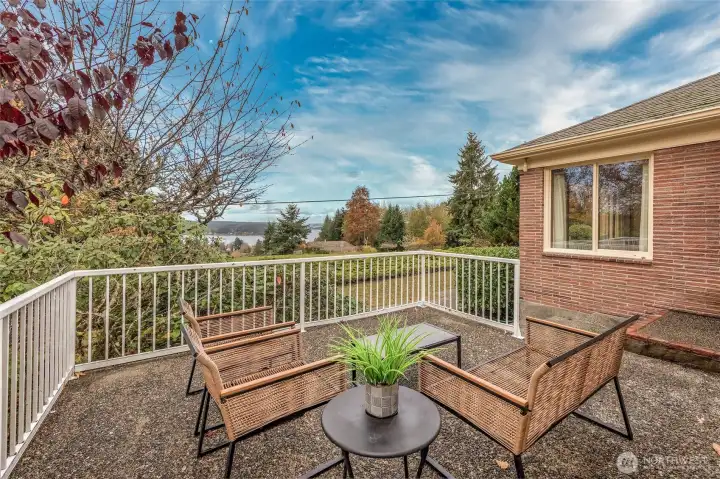 Perched in the sunny, quiet community of Dockton, this solid mid-century home captures stunning views of Quartermaster Harbor.