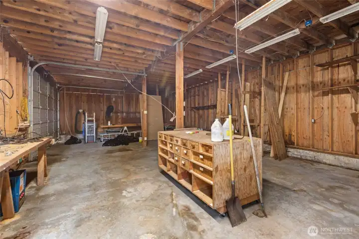 A large garage/shop and outbuilding provide ample workspace.