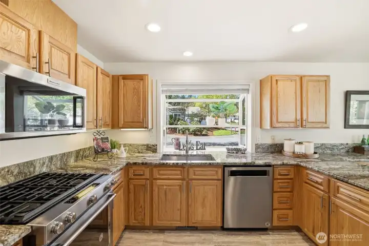 Updated kitchen with granite countertops. Stainless appliances and gas range