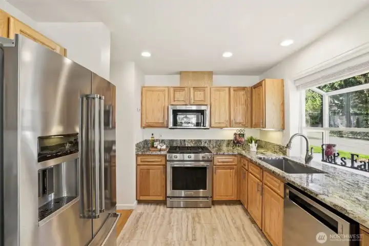 Updated kitchen with granite countertops.