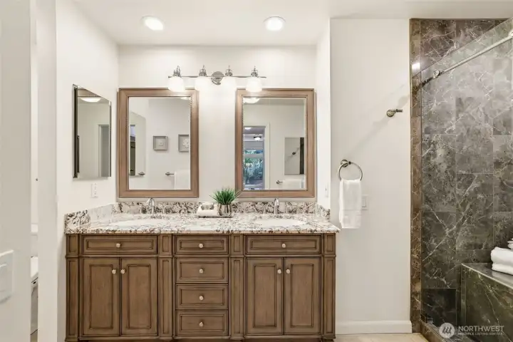 Updated vanity with granite top. Dual undercounter mount sinks