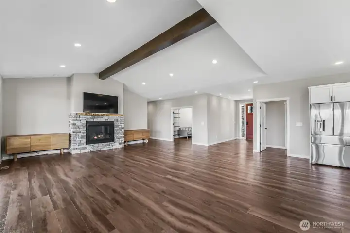 Vaulted ceilings with beam accents are just one of the many luxuries of this property.