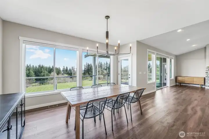 A meal with a view in this gorgeous dining room. Also access outside directly from this space.
