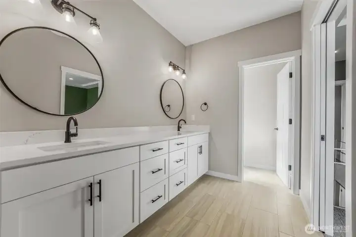 Luxury meets functionality in the primary bedroom’s ensuite.