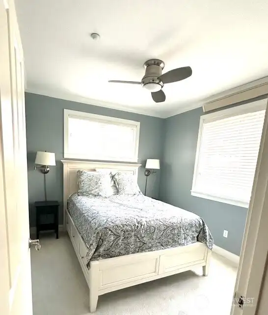 On the opposite end of the condo are the other two bedrooms and ...