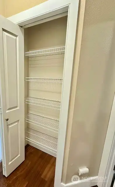 A linen closet near the bedrooms. A linen closet near the bedrooms.