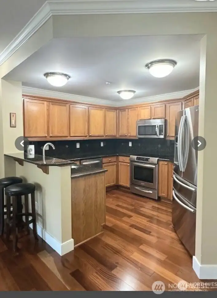 Beautifully updated kitchen with granite counters. Stainless steel appliances too!