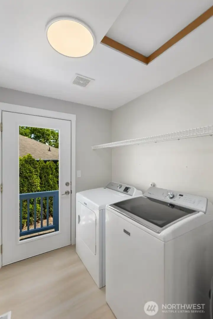 Laundry Room/ Back Door with view of the Attic access.