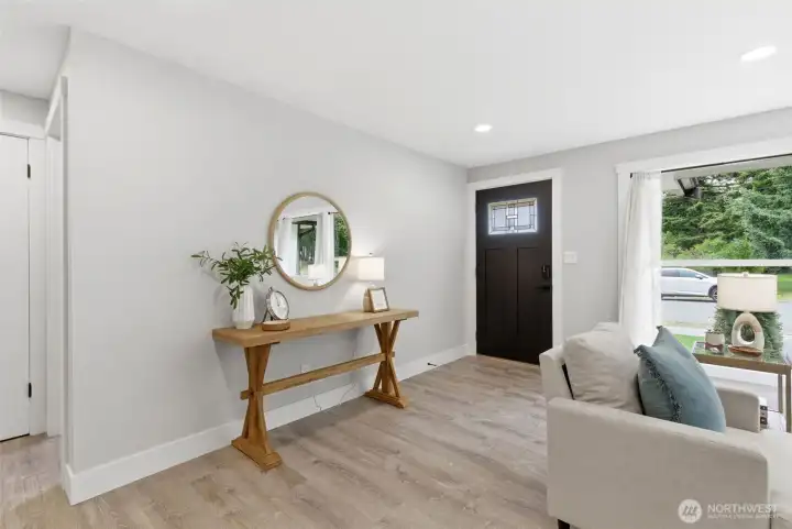 Open floor plan with easy-care LVP flooring throughout. Freshly painted inside and out