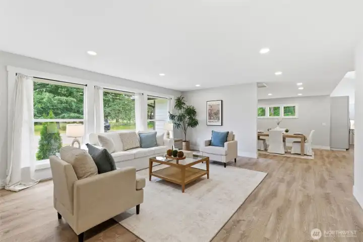 Natural light floods your living space through the large front windows