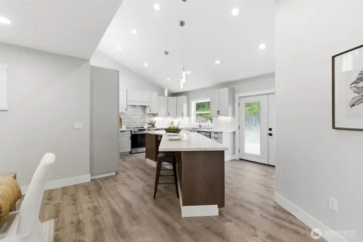 Recessed lighting keeps your space light and bright and the vaulted ceilings add great design.
