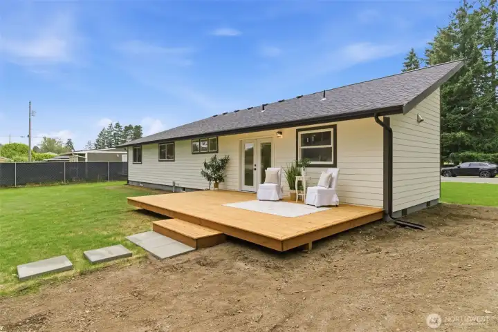 French Doors lead from the kitchen to the entertainment-sized backyard deck