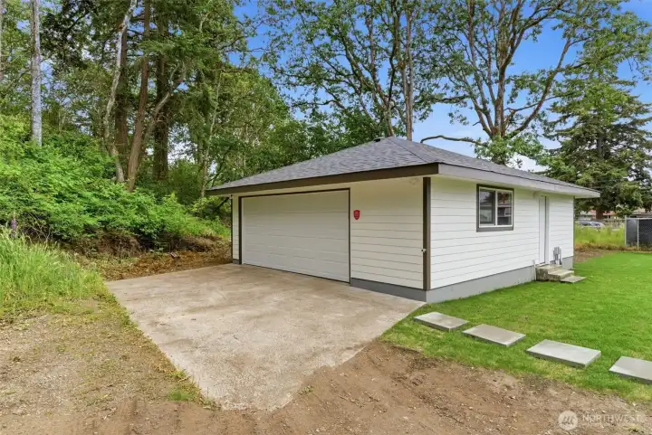 Detached 26'x30' garage includes a new insulated door, dedicated 125-amp electrical panel, plumbed for cold water, cable & internet installed + additional 60-amp EV circuit. Hobbies anyone?
