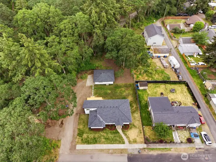 This home features a gas forced air heating system & electric air filter, 50-gallon gas water heater, full insulation package + new energy efficient windows. The property extends to the back of the garage .