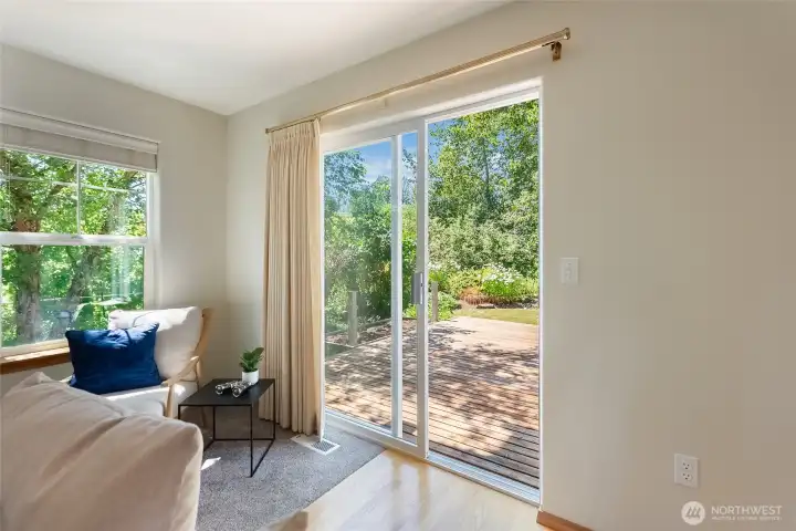 Sliding door to a large deck and flat back yard is perfect for indoor/outdoor summers