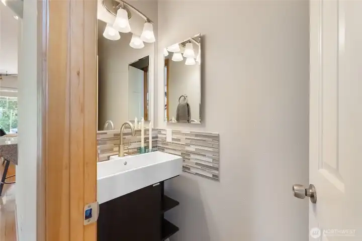 Main floor half bath with custom tile