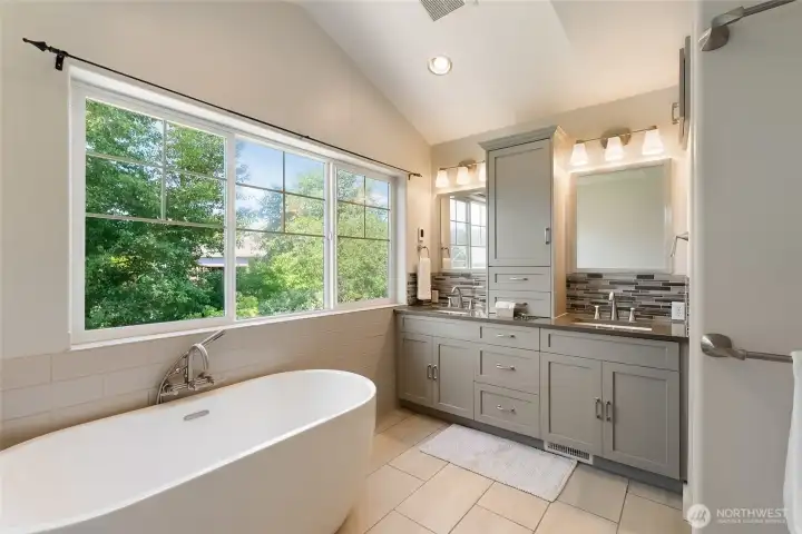 Fully remodeled primary bath with spa like feel and lots of light. Soaker tub, double vanity, and lots of storage