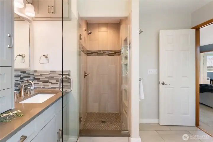 Custom tiled shower with glass door