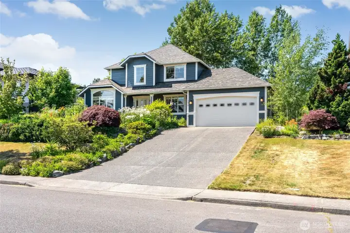 Perched above the street for wonderful expansive views. Flat parking at the top of the driveway