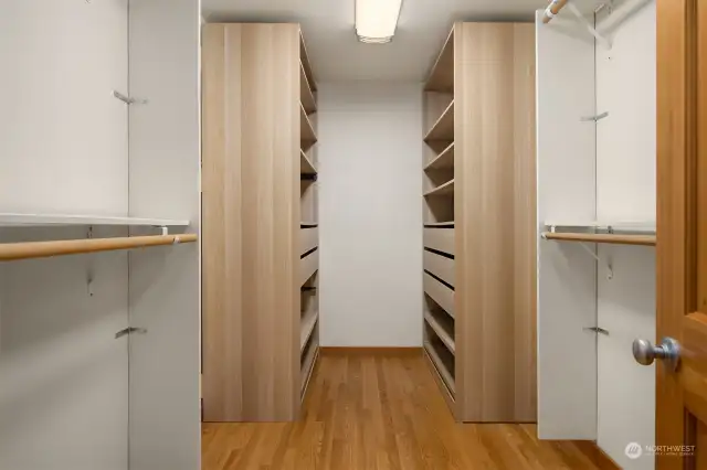 The walk-in closet in the primary suite has terrific built-in cabinetry and storage.