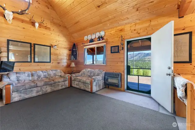 Cabin great room is warmed with propane wall heat and or freestanding woodstove.