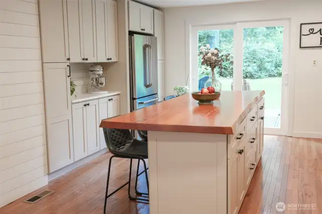 Kitchen with large island with eating space