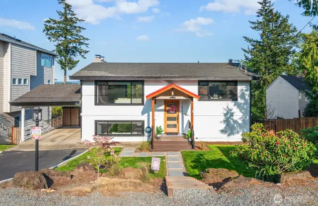 Welcome Home! Beautifully landscaped with new pavers. Two generously sized sheds in carport fit perfectly and still allow form 1 undercover parking spot will stay with the home. Additional parking in driveway and gravel pit up top for plenty of guest parking!