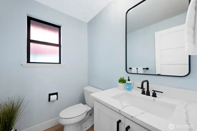 Powder room perfectly located on main floor.