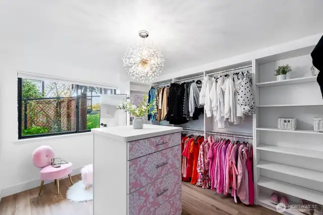 The 3rd bedroom converted to additional walk-in closet and utility room. Custom California closets can stay for a price or negotiated with a strong offer. This room can be converted back to a bedroom prior to closing.
