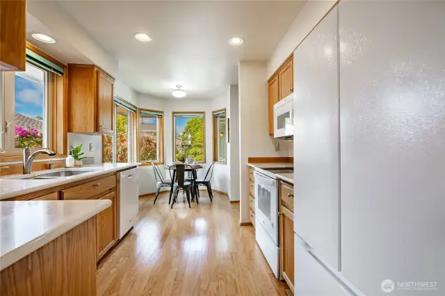Wonderful breakfast nook surrounded by windows & private landscaping