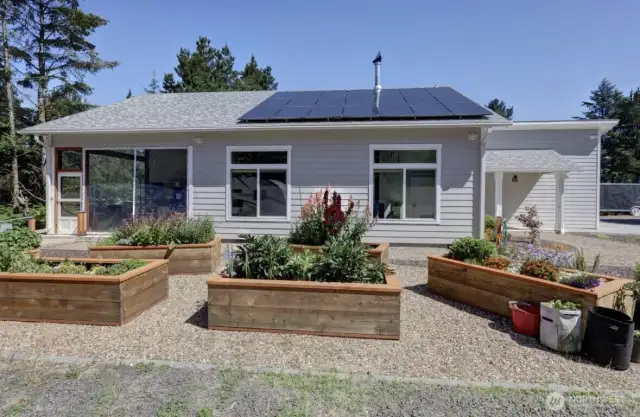 Cement Planked siding, Leaf Guard Gutters, and Solar Panels, and Raised Garden beds. This place has so much to offer.