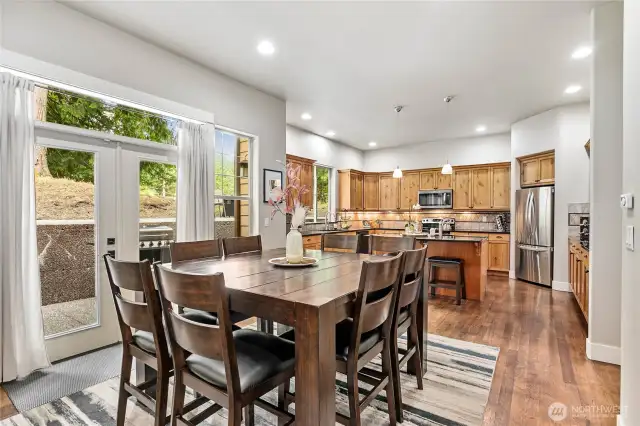 Dining space off kitchen with access to patio and fairway.