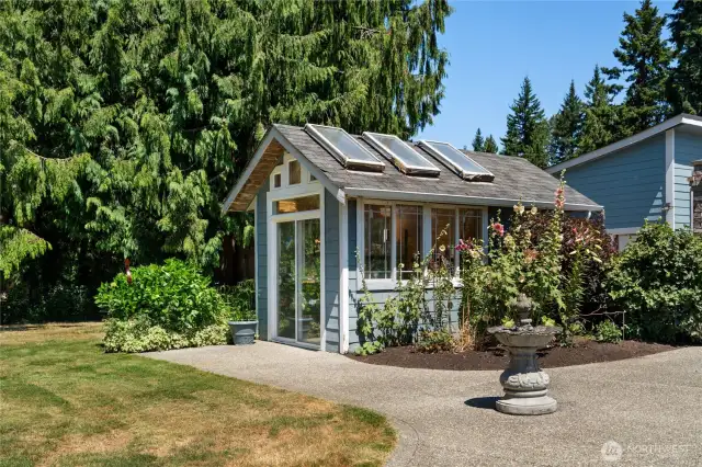 Beautifully maintained main residence with lush landscaping and mature trees.