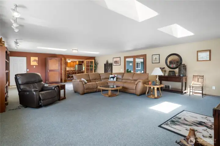 Bright living room with vaulted ceilings and ample natural light