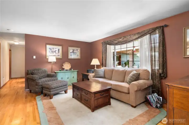 Comfortable and open living area with hardwood flooring throughout.