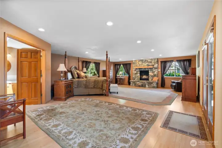 Expansive corridor takes you into the expansive primary bedroom