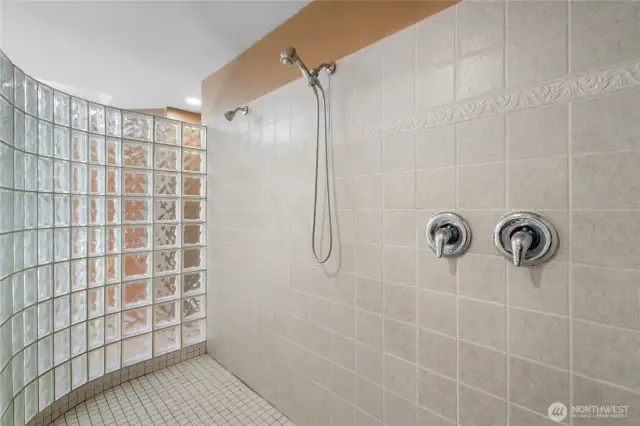 Well-appointed bathroom with large vanity, full tub, and shower