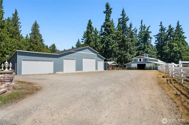 Oversized shop and garage building with multiple bays and separate access from main home.