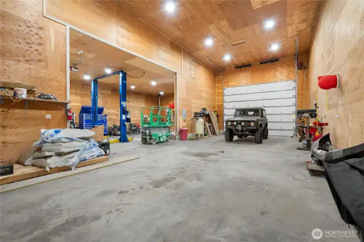 Ideal setup for auto or equipment work, featuring a professional-grade lift which is in included in the sale