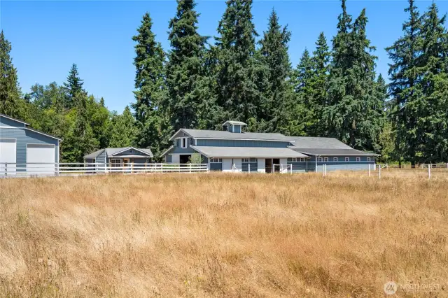 Private setting with open field views, perfect for guests or rental use.