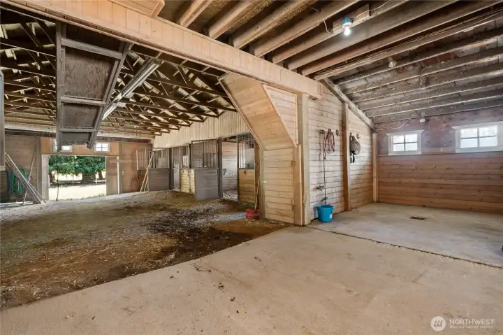 Spacious barn zone with built-in wash rack and grooming space, designed for ease of care and horse comfort.