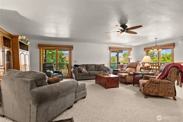 Large upstairs living room with mountain views and access to the covered deck