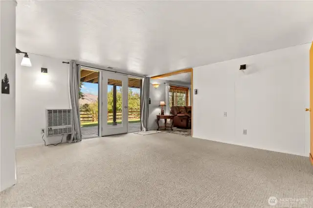 Lower level sitting area and access with patio area and private sitting area