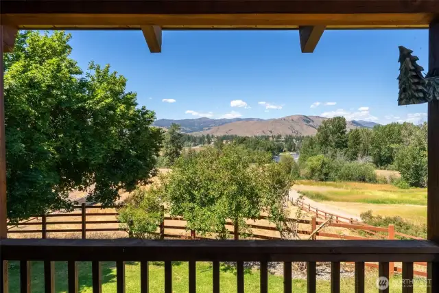 Stunning river and mountain views off the covered deck over looking the riding arena